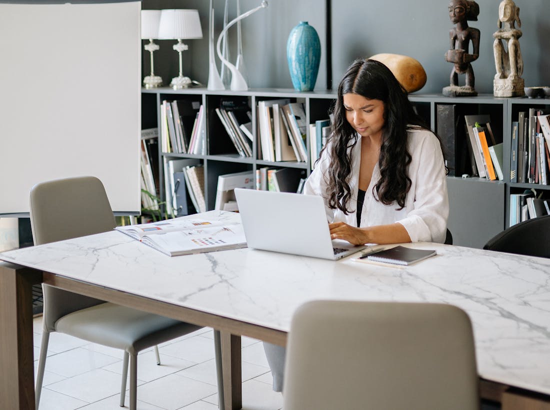 Indian freelancer reviewing invoices and payments on a laptop